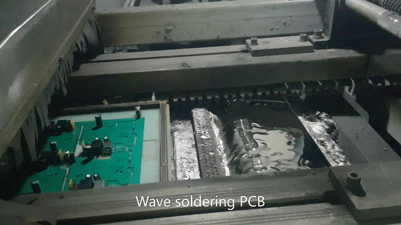 Video: Wave Soldering Process for Electronics Manufacturing. PCB Through-Hole Assembly